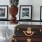 Bedroom with stylish pictures and travel luggage