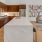 Kitchen with upgraded Moen faucets and fixtures, elevated Thermador appliances with double-oven combo, and imported Italian cabinetry